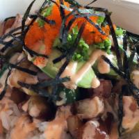 Poke Bowl · Assort of fish marinated w/ poke sauce served over sushi rice topped w/ avocados, cucumbers,...
