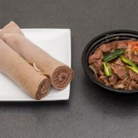 Beef Tibs · Beef cubes sautéed with onion, tomato, garlic, and jalapeno and kibe.