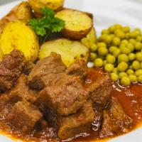 Old-Fashioned Beef Stew · Slowly cooked chunks of beef & spices.
Served with Herb Roasted Potato & Peas