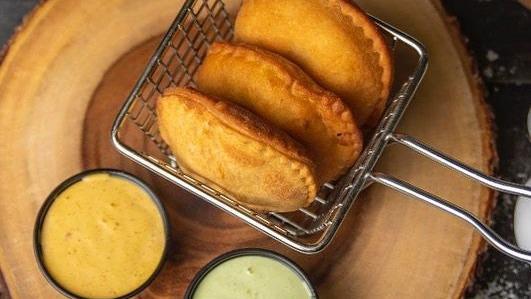 Vegan Empanada · Filled with black beans and plantain.