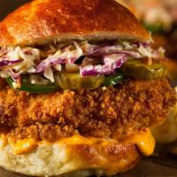 Fried Chicken Burger With Cheese · Southern-style breaded chicken breast, creamy cheese, tomatoes, onions, lettuce, ketchup, an...