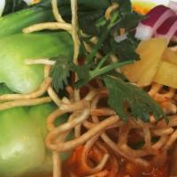 Kao Soi · Our chef special. Soft egg noodles in curry broth with choice of meat, bok choy, shallots, a...