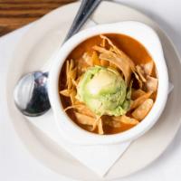 Chicken Tortilla Soup · Topped with tortilla strips and fresh avocado.