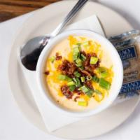 Beer Cheese Soup · Creamy and cheesy soup made with our ocean beach IPA beer topped with cheese, bacon and garn...