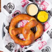 Baked Pretzel · Jumbo Bavarian pretzel. Served with a side of Beer Cheese Soup and Mustard for dipping.