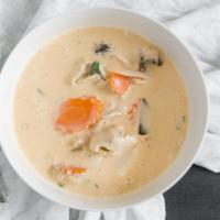 Tom Kha Cup · Hot and sour soup with coconut milk, galanga root, mushrooms, lemongrass, carrot, lime leave...