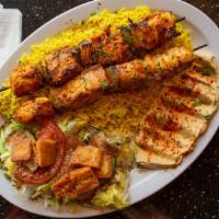 Chicken Kabob · Cubed chicken breast on a skewer marinated with tomato sauce, special spices, olive oil, and...