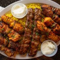 Syrian Meat Combo For Two · A combination platter with two lamb kabobs, two chicken kabobs and two kafta kabobs. Include...