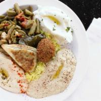 Sampler Plate · A sample of our hummus, garlic dip, baba ghanouj, syrian green bean salad, grape leaf, falaf...
