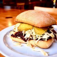 Bbq Brisket Sandwich · Slow cooked brisket on a ciabatta bun topped with chipotle slaw and sliced pickles
