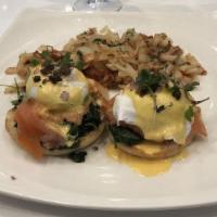 Salmon Benedict · Tomato slices, sautéed spinach, capers, red onions, two poached eggs, house-made hollandaise...