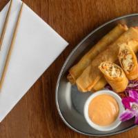Firecracker Fried Spring Rolls · Seasoned and spiced chicken, laced with sweet shallots, chicken and garlic, collide with chi...