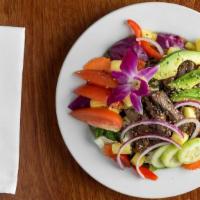 Crying Tiger Beef Salad (Gf) · Wild and exotic. Fiercely seasoned beef seared in lime juice, garlic, habanero, and nam pla....