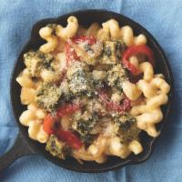 Pesto Grilled Chicken · A bed of cavatappi pasta with pesto grilled chicken, grilled onions, roasted red peppers, an...