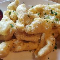 Garlic Nuggets · You'll love these fried dough nuggets tossed in savory garlic butter and parmesan!
