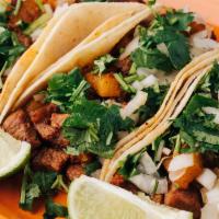 *  Street Tacos (3) · Your choice of meat. Garnished with onions, cilantro, lime, and roasted tomatillo sauce. Cho...
