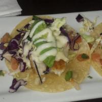 Fish Tacos · Two tortillas filled with lightly battered or grilled fish, and topped with a tangy coleslaw...