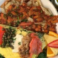 Lox & Cream Cheese Cheese Omelette · smoked salmon, dijon-cream cheese, capers, grilled onions, and spinach with hash brown potat...