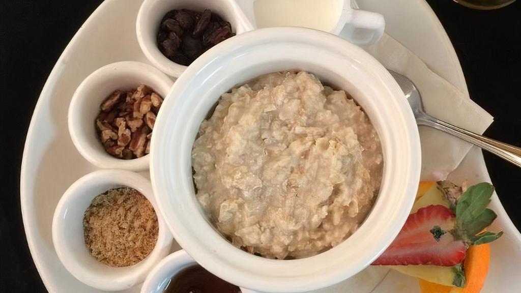 Oatmeal & Toasted Pecans · served with a side of milk, maple syrup, brown sugar, and raisins