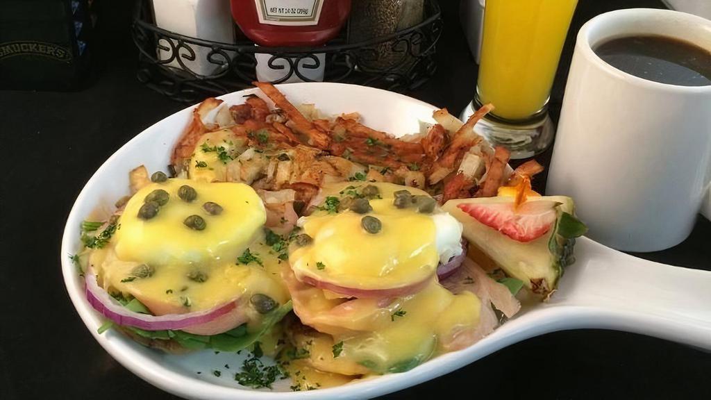Smoked Salmon-N-Eggs Benedict · english muffin, smoked salmon, poached egs, hollandaise, spinach, red onion, capers, hash browns (contain green onions)