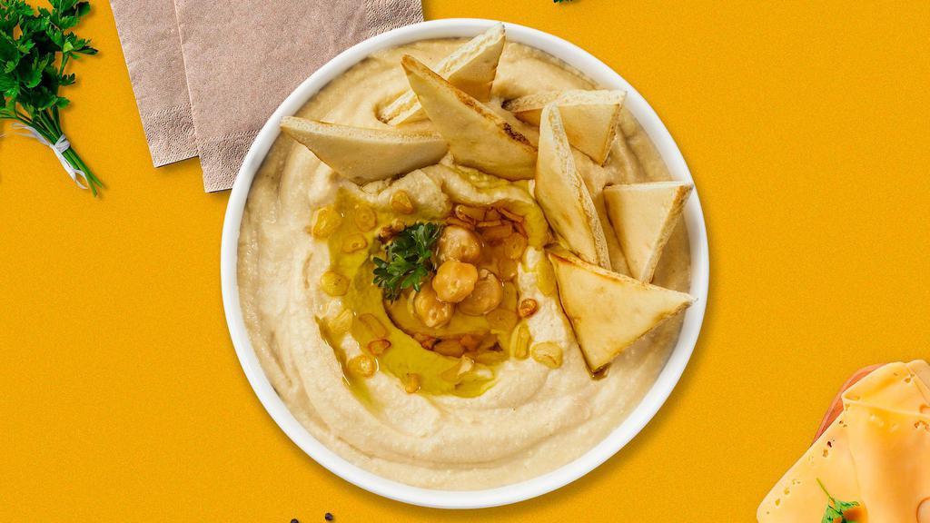 Hummus Plate · A mixture of mashed garbanzo beans, tahini, and olive oil served with pita bread.