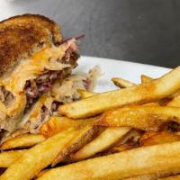 Reuben & Chips · A generous portion of our homemade corned beef on marble rye, with sauerkraut, Russian dress...