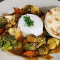 Vegetable Curry · Seasonal vegetables in our spicy curry sauce, served over Jasmine rice and naan bread.