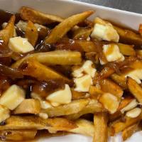 Poutine · House cut British chips, real Cheddar curds, and our legendary Bisto Guinness onion gravy.