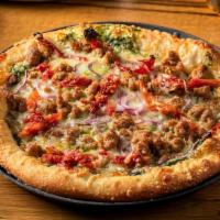 Medium Mike · Italian sausage, sun-dried tomatoes, red onions, Parmesan and spinach or ricotta sauce.
