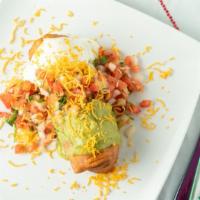 Chicken Chimichanga · Served with guacamole, sour cream, lettuce and Mexican salsa. Filled with chicken, beans, an...