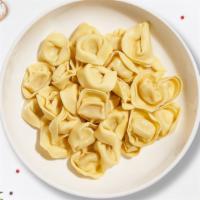 Build It Bob Cheesy Tortellini · Cheesy Tortellini cooked with your choice of sauce, veggies, and meats and topped with black...