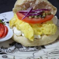 The New Yorker Sandwich · UB house gluten-free and eggless breakfast patty, cream cheese, red onion, tomato, and capers.