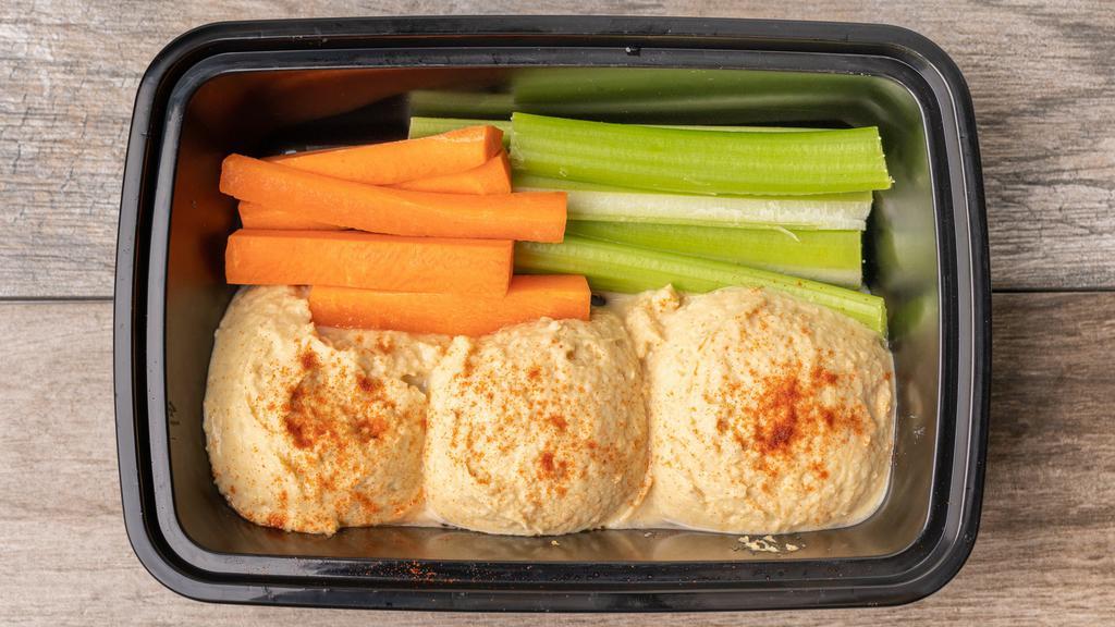 Hummus Platter · 3 scoops of our firm and oil-free hummus served cold with carrots and celery. Add side of tortilla chips for an additional charge.