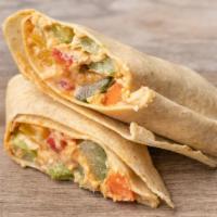 Veggie And Hummus Wrap · Hummus and raw veggies: thin sliced carrot, tomato, roasted red pepper, mixed greens, cucumb...