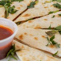 Fully Loaded Quesadilla · Stuffed with chorizo and topped with cilantro, sour cream, and UB salsa.