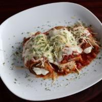 Eggplant Rollatini · Thinly sliced Breaded Eggplant stuffed with a special seasoned Ricotta Cheese covered with M...