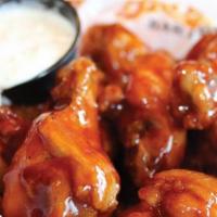 Bone-In Wings · Traditional wings tossed in your choice of Brothers sauces.