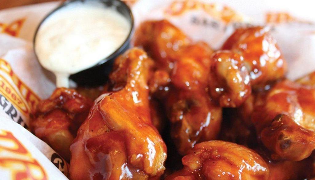 Bone-In Wings · Traditional wings tossed in your choice of Brothers sauces.