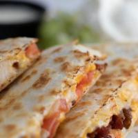Grilled Shredded Chicken Quesadilla · Large flour tortilla, grilled shredded chicken, melted cheddar and pepper jack cheese. Serve...