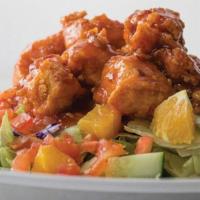 Thai Orange Chicken Salad · Mixed greens with fresh cucumber, orange and tomato all under sweet-and-spicy, hand-breaded ...