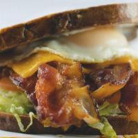 The Ultimate Blt · Toasted marble rye bread loaded with bacon, lettuce, tomato, melted cheddar cheese, mayo and...