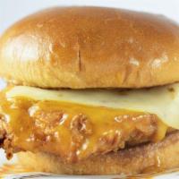 Nashville Hot Chicken Sandwich · Breaded and fried chicken breast covered in Brothers Nashville inspired golden BBQ sauce and...