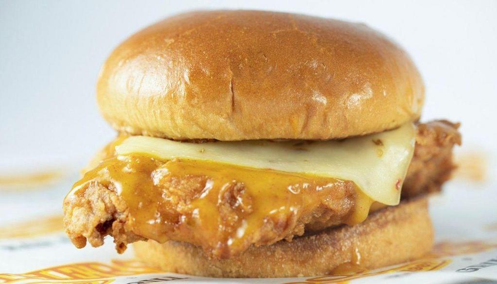 Nashville Hot Chicken Sandwich · Breaded and fried chicken breast covered in Brothers Nashville inspired golden BBQ sauce and topped with pepper jack cheese. Served on a toasted bun with creole mayo.