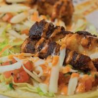Cajun Sriracha Fish Tacos · Two street-style soft corn tortilla tacos with cajun sriracha fish, sriracha aioli, queso fr...