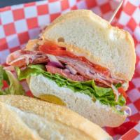 Spicy Skyler · Salami, pepperoni, ham, melted cheese, jalapeño cream cheese roasted bell peppers, spicy may...