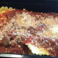 Meat Lasagna · Italian dish made of stacked layers of thin flat pasta alternating with fillings. layered di...