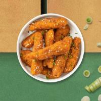 Sesame Chicken Strips · Chicken tenders breaded and fried until golden brown. Served with your choice of dipping sau...