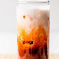 Thai Iced Tea · Classic Ceylon black tea sweetened with a splash of milk or your favorite non-dairy product