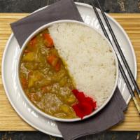 Vegetable Curry · Vegetable curry made with potatoes, carrot and onion. Served with rice