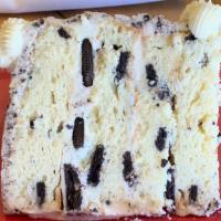 Cookies And Cream · Oreo cake batter with chunks of Oreo cookie baked in.  Cake is iced and filled with Oreo coo...